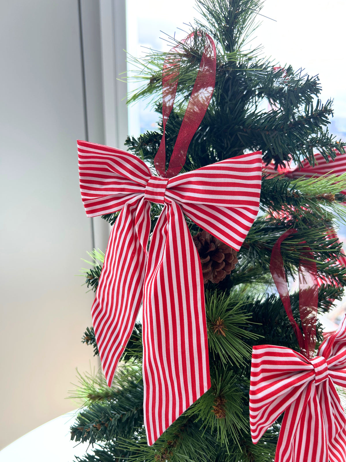 Red Striped Candy Cane Style Christmas Tree Bow