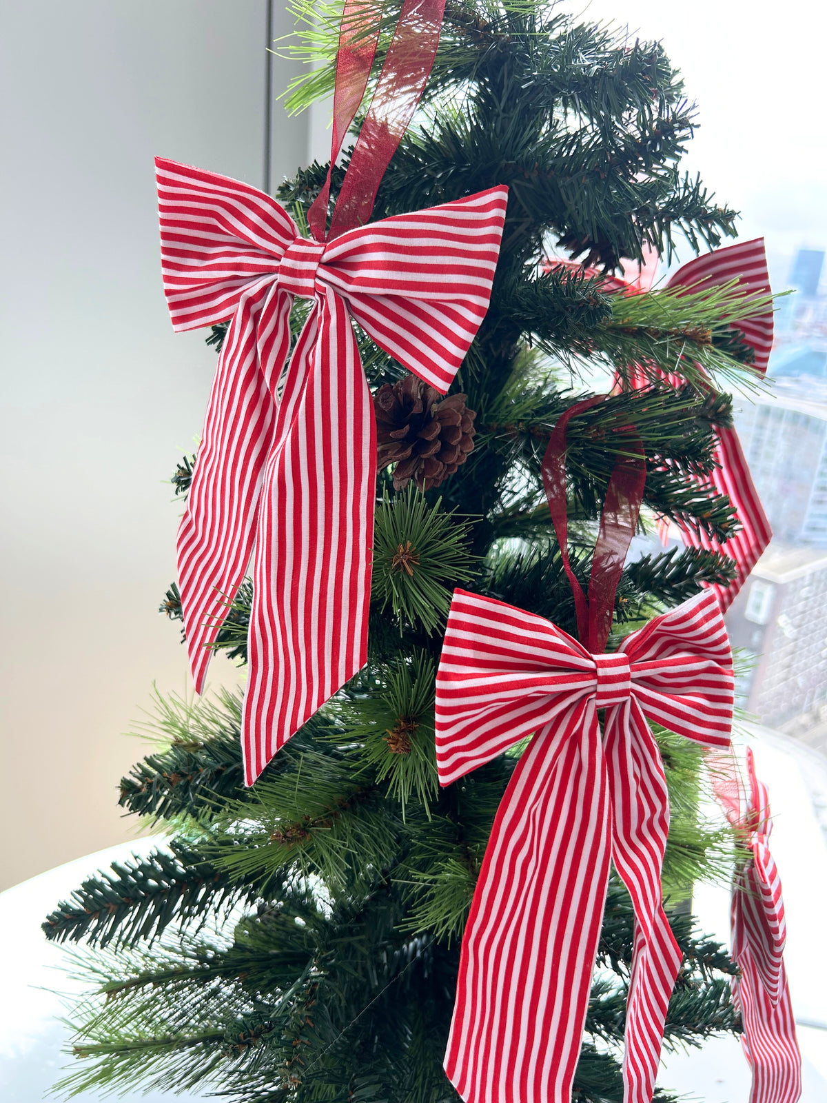 Red Striped Candy Cane Style Christmas Tree Bow